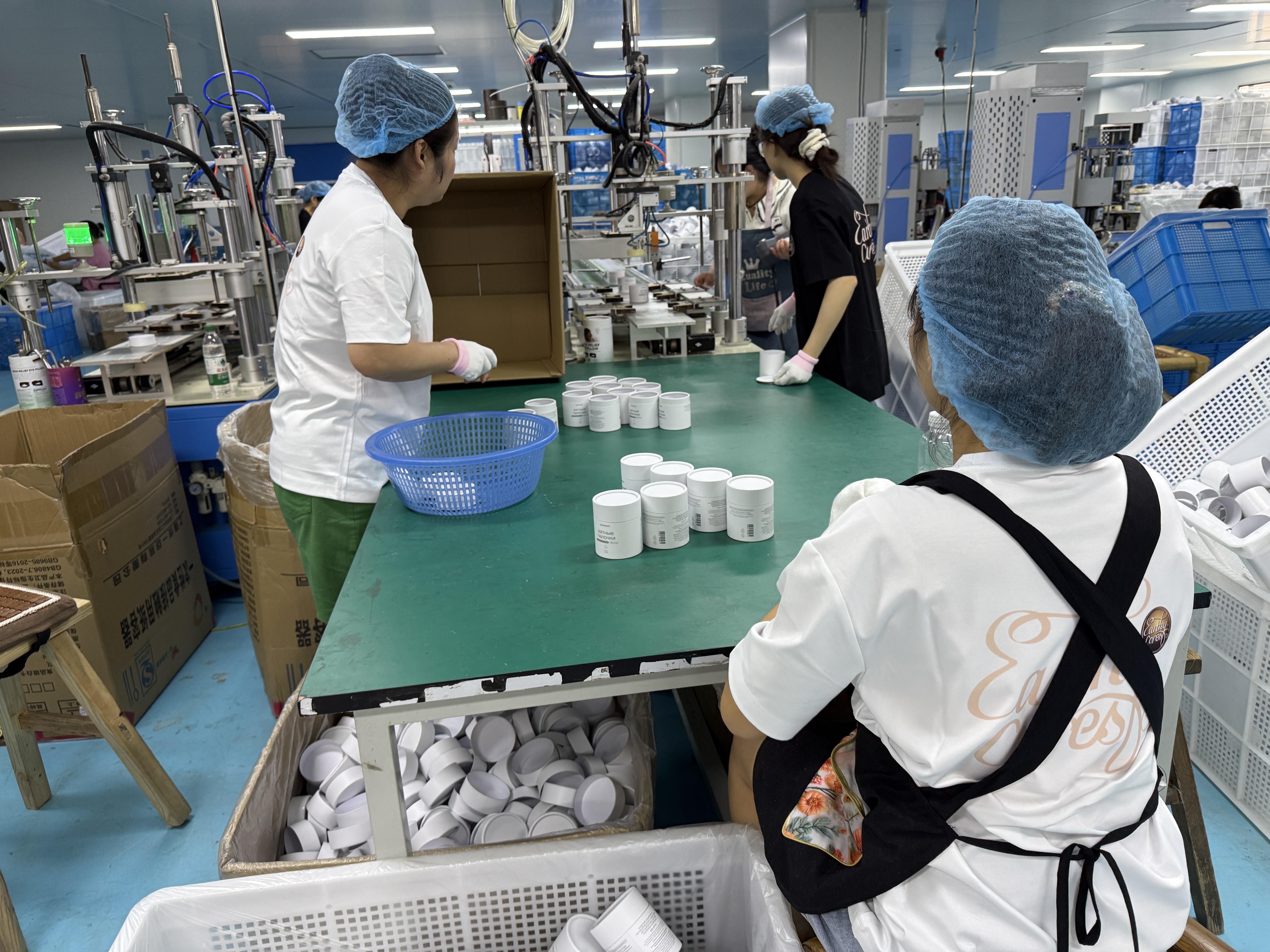 Assembly stage for custom paper tube packaging