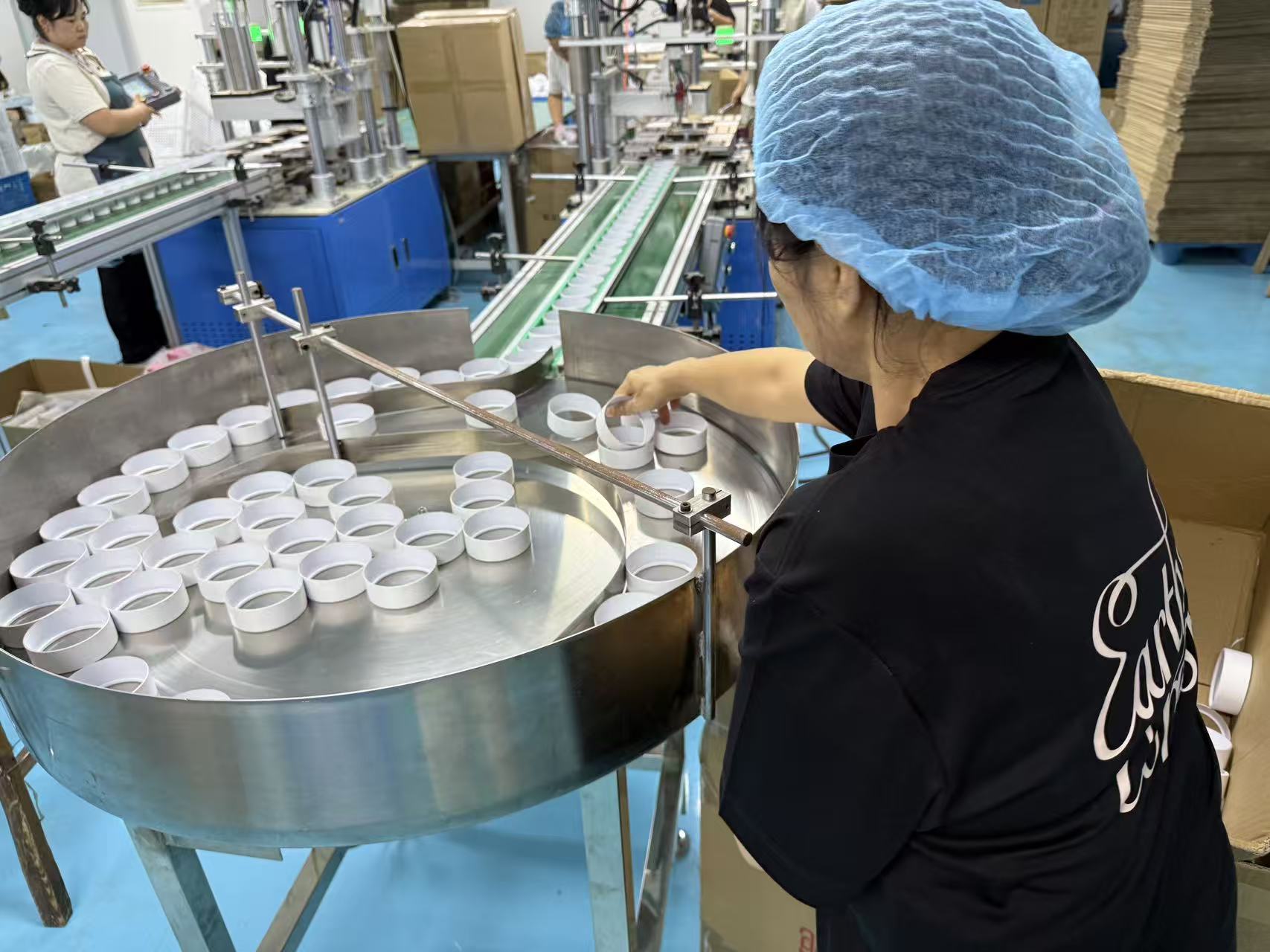 Quality inspection of paper tube cap components before assembly